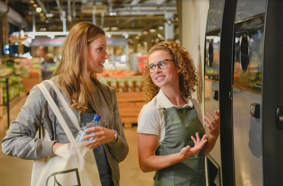 consumer-and-retailer-at-reverse-vending-machine